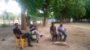 Sam Lumborg relaxing with locals with Ethiopia.