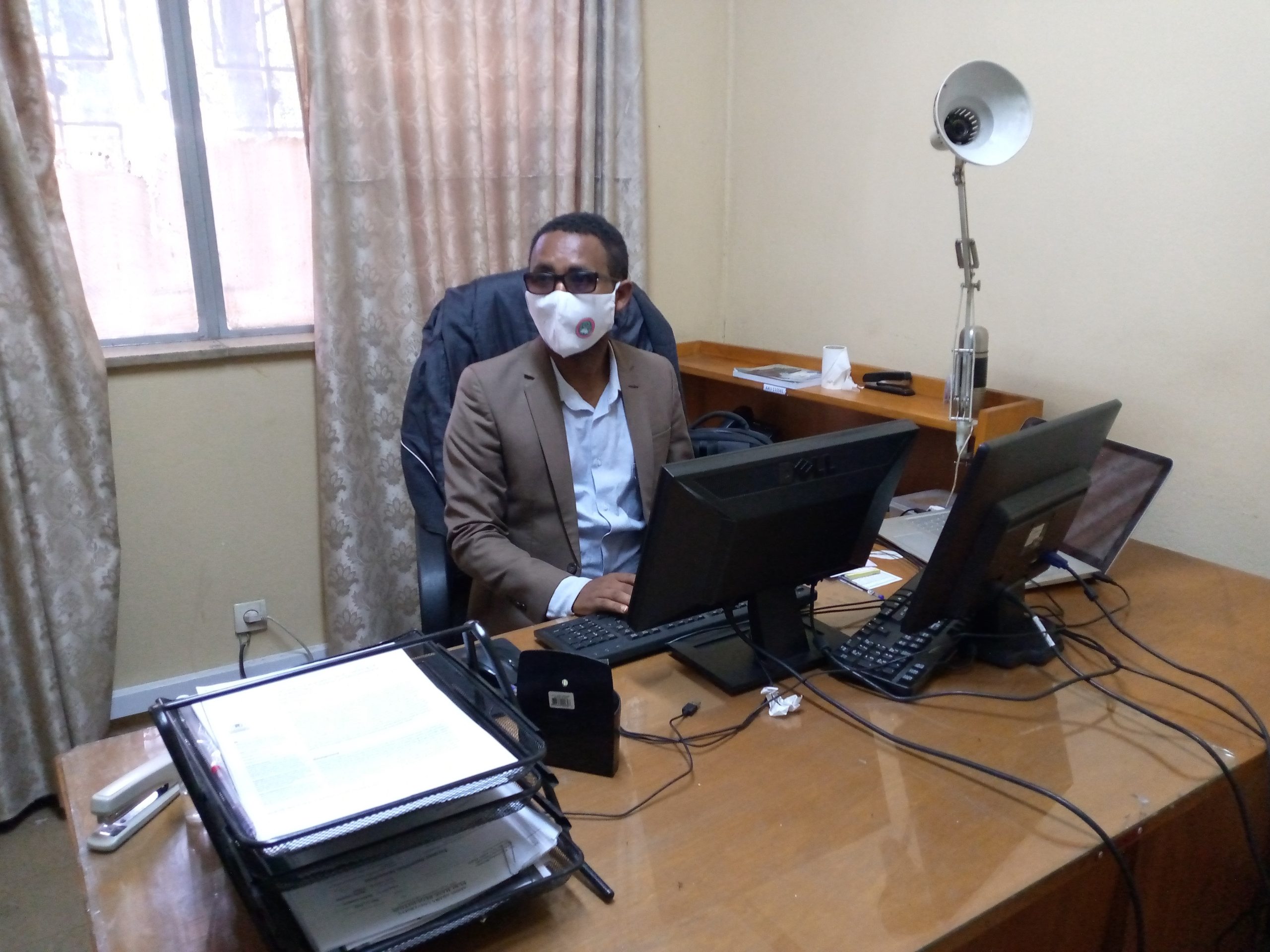 Tilahun in his office